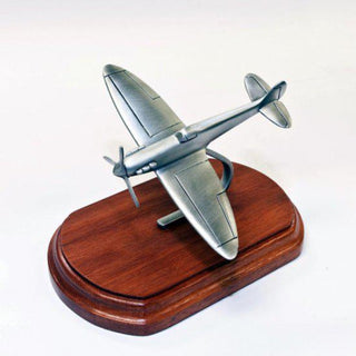Handcrafted figurines collection featuring detailed pewter airplane design on a wooden base