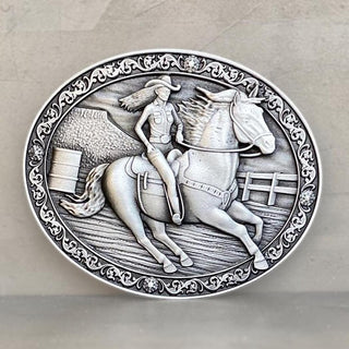 Jessicas Pride Belt Buckle featuring a detailed scene of a cowgirl riding a horse