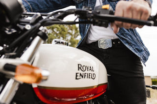 Buckingham Pewter Live to Ride belt buckle displayed on a rider with a Royal Enfield motorcycle