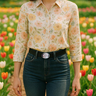 Model wearing a floral shirt and jeans, showcasing the Tulip Elegance belt in a tulip field