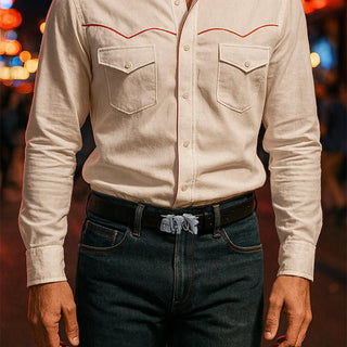 Classic styled man wearing denim jeans and a white shirt with Roped and Wrangled belt buckle